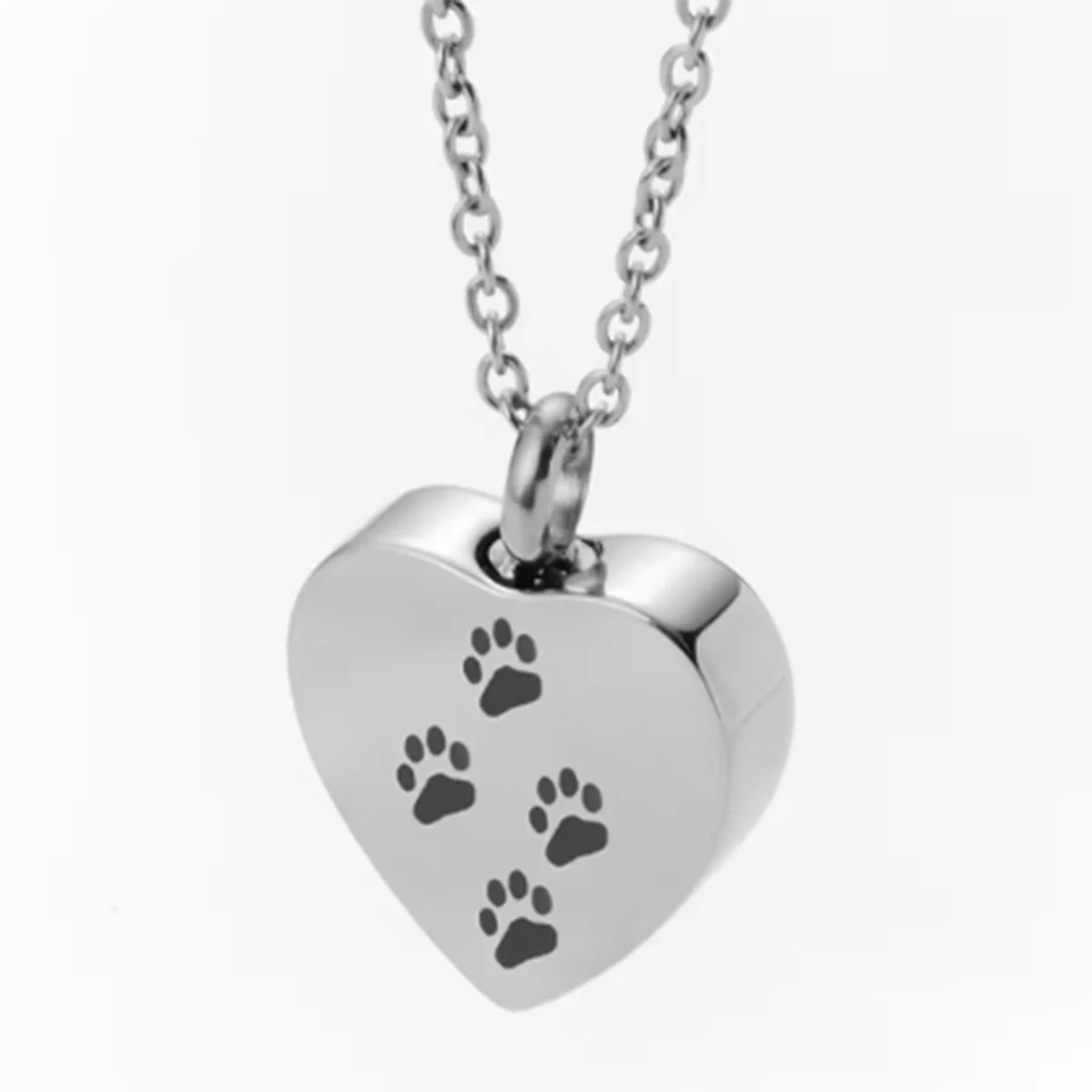 Silver stainless steel heart-shaped necklace with four paw prints engraved on it