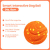 An orange, textured interactive dog ball with yellow spots, designed for medium and large breeds.