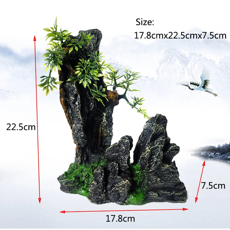 A resin aquarium rockery featuring a cave structure, mossy rocks, and small green trees.