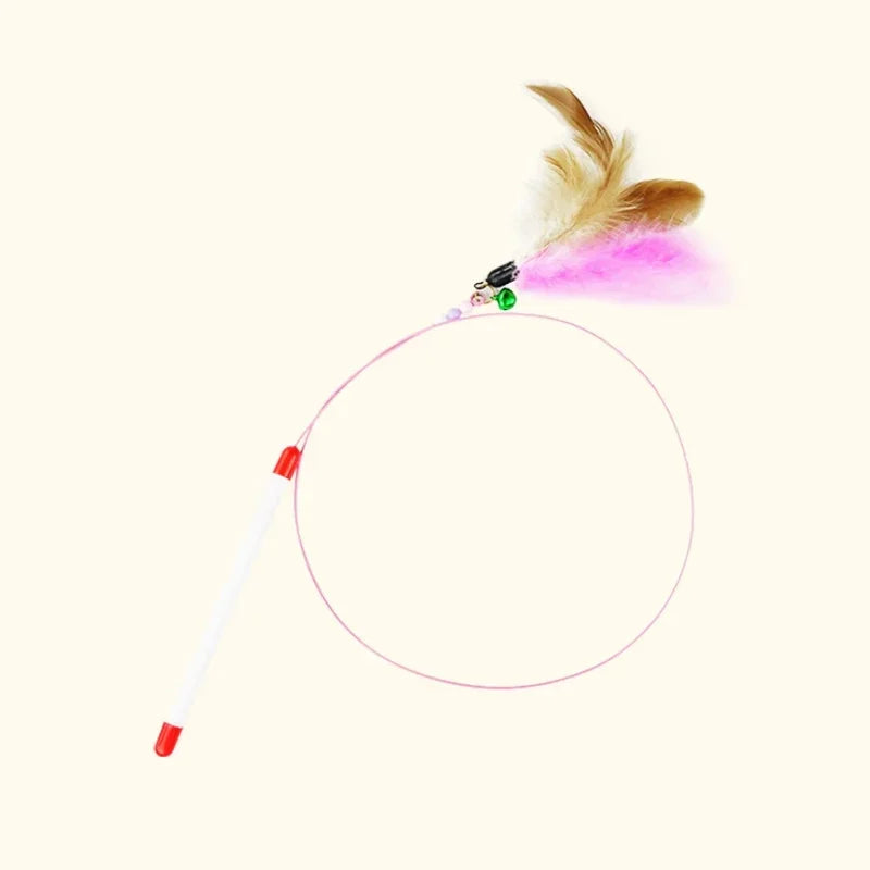 A feather wand cat toy with a bell and pink fluff is shown against a white background.
