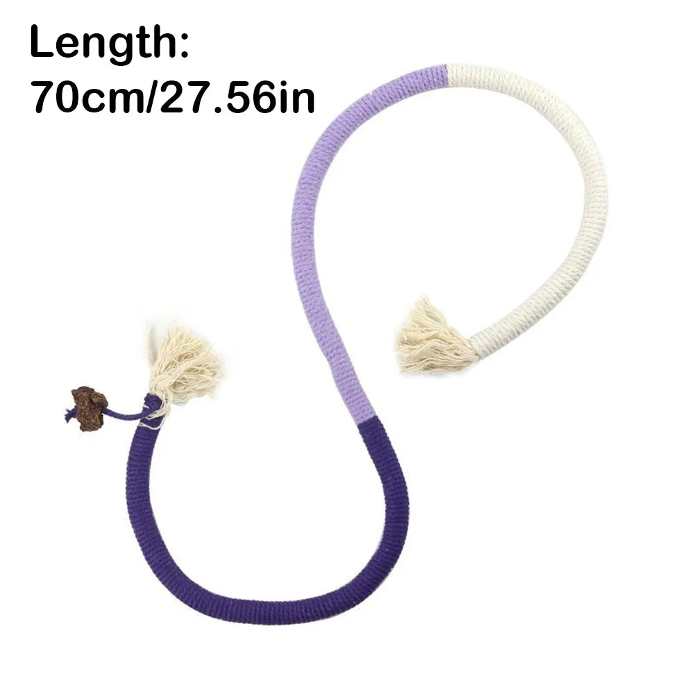 A purple and white cotton rope cat toy with a silvervine fruit attached.