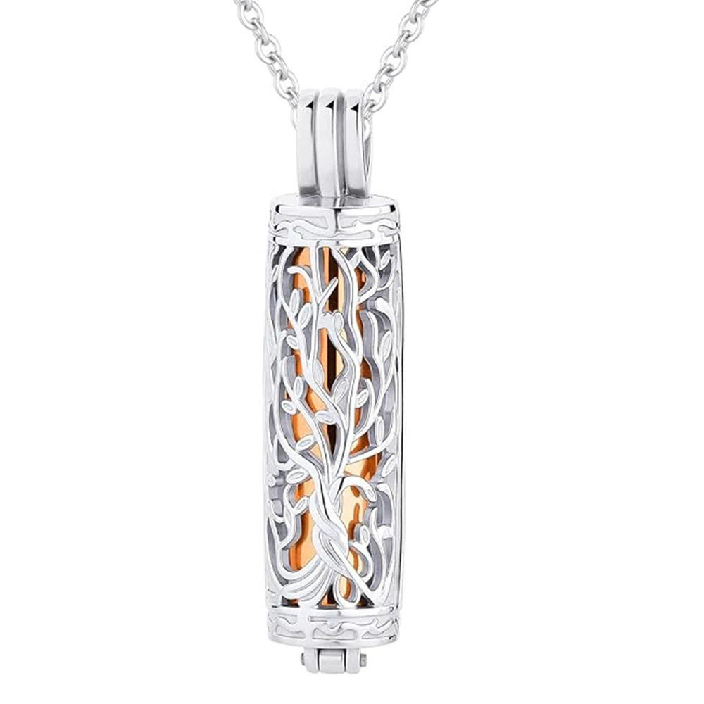 A silver stainless steel cylinder cremation urn necklace featuring an intricate design of intertwining branches and a central