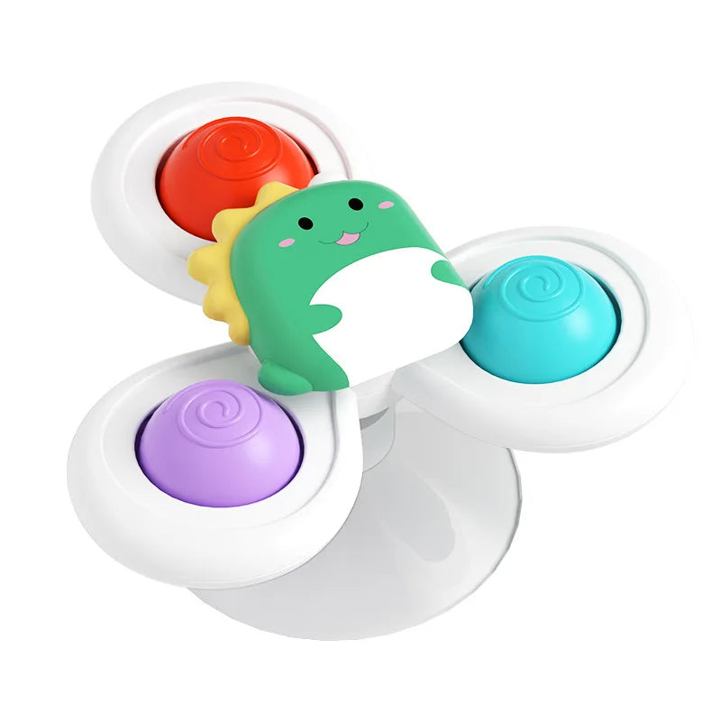 Un set de trois jouets de bain en plastique colorés en forme de chat, avec des designs orange, jaune et vert.