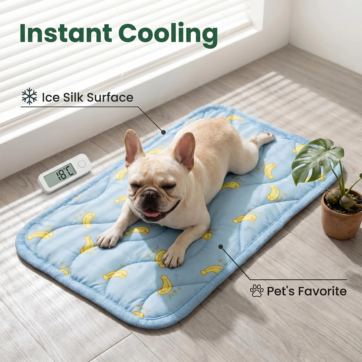 A light-colored dog lying on a blue mat with yellow banana patterns, demonstrating instant cooling for pets.