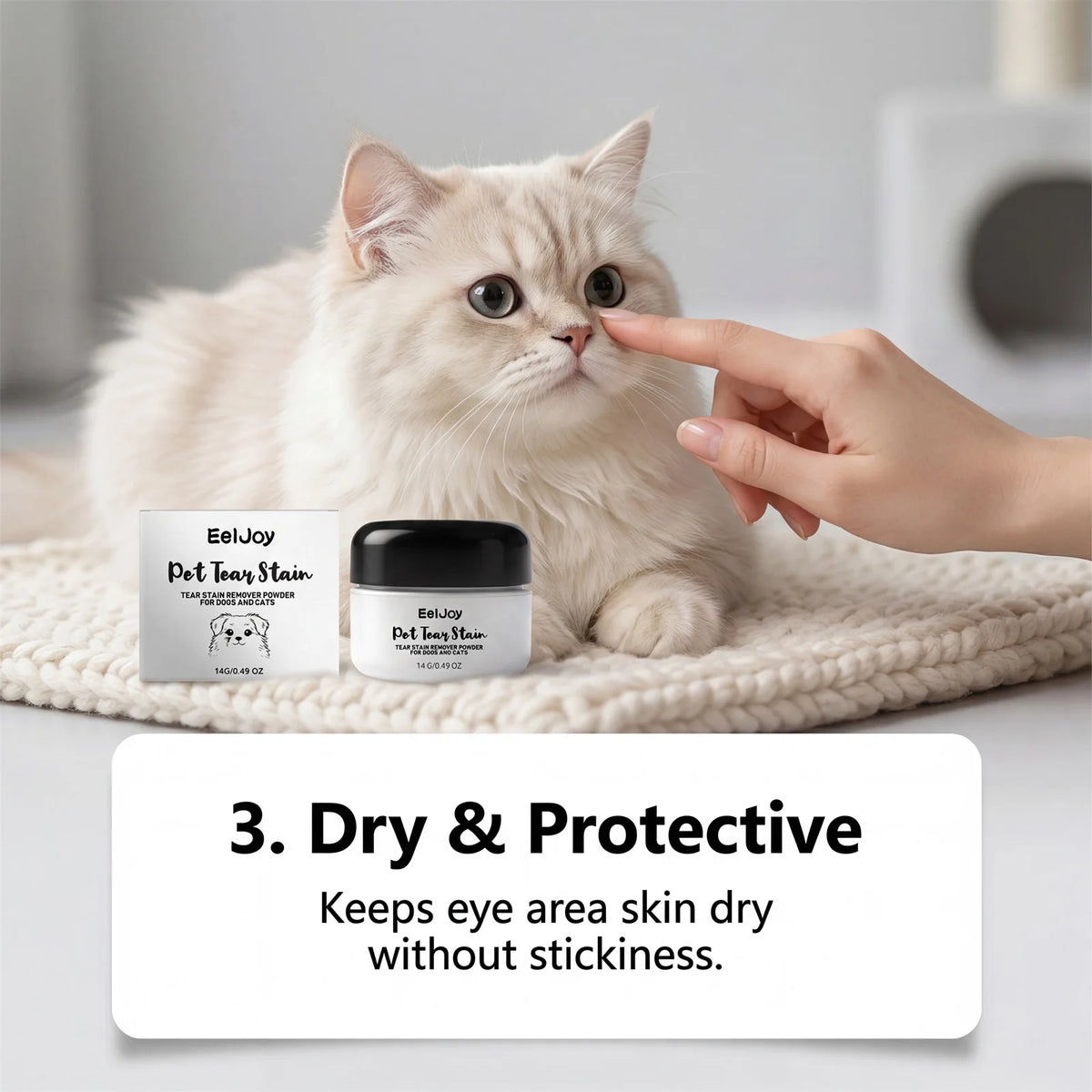 A paw gently touches a cat's face while a jar of EelJoy Pet Tear Stain Remover Powder is displayed on a white blanket.
