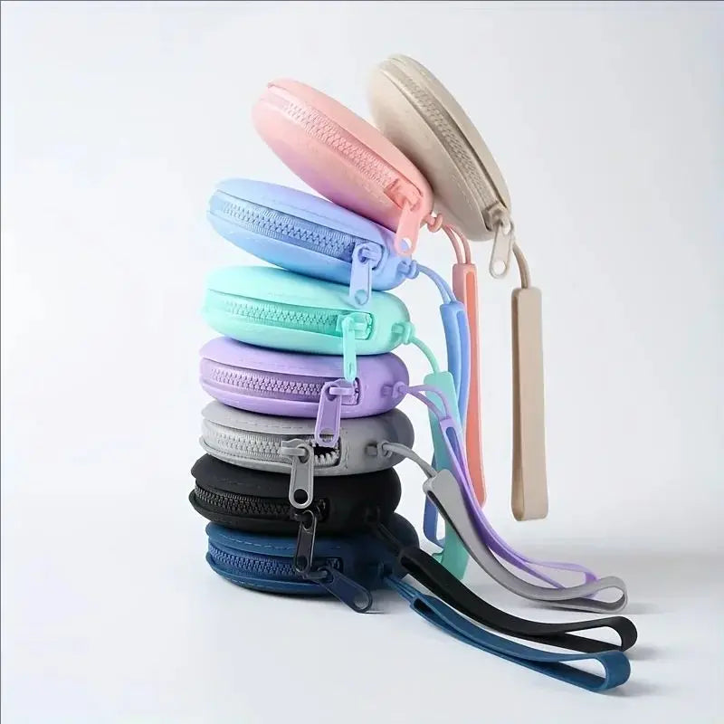 A stack of colorful silicone pet treat pouches in various shades including pink, blue, purple, and gray.