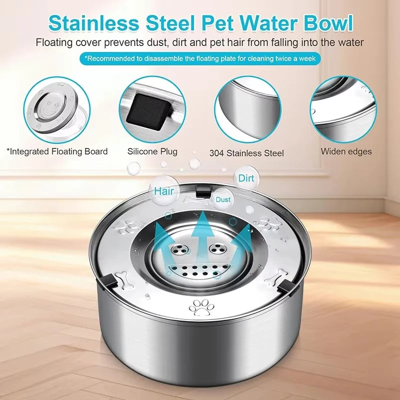 A stainless steel pet water bowl with a floating cover and wide edges shown on a wooden floor.