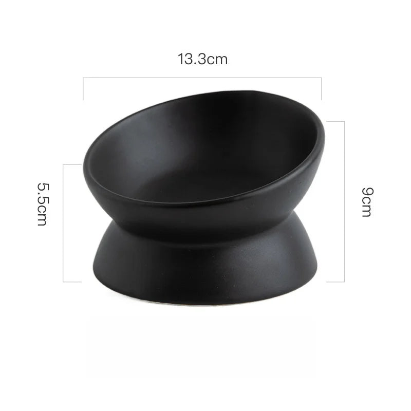 Black ceramic cat bowl with a raised stand, measuring 13.3cm wide and 9cm tall.