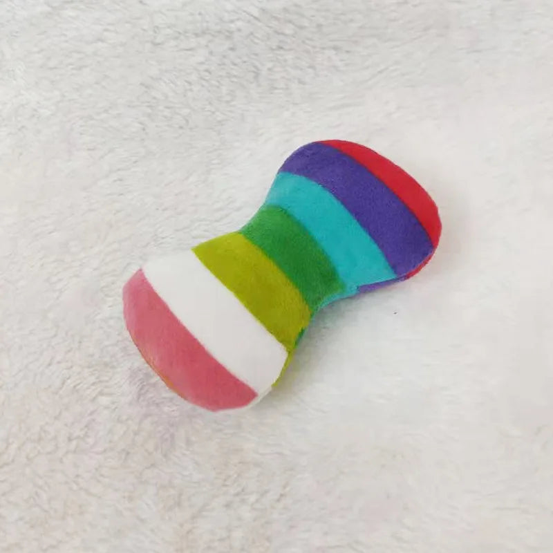 A bone-shaped squeaky plush dog toy featuring horizontal stripes of purple, blue, green, and pink.
