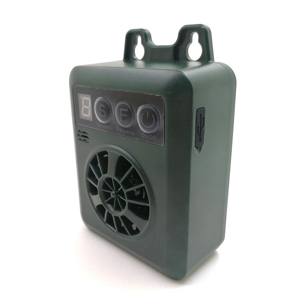 Dispositif électronique anti-aboiement ultrasonique pour chiens, vert foncé, avec grille circulaire et interrupteur marche/ar