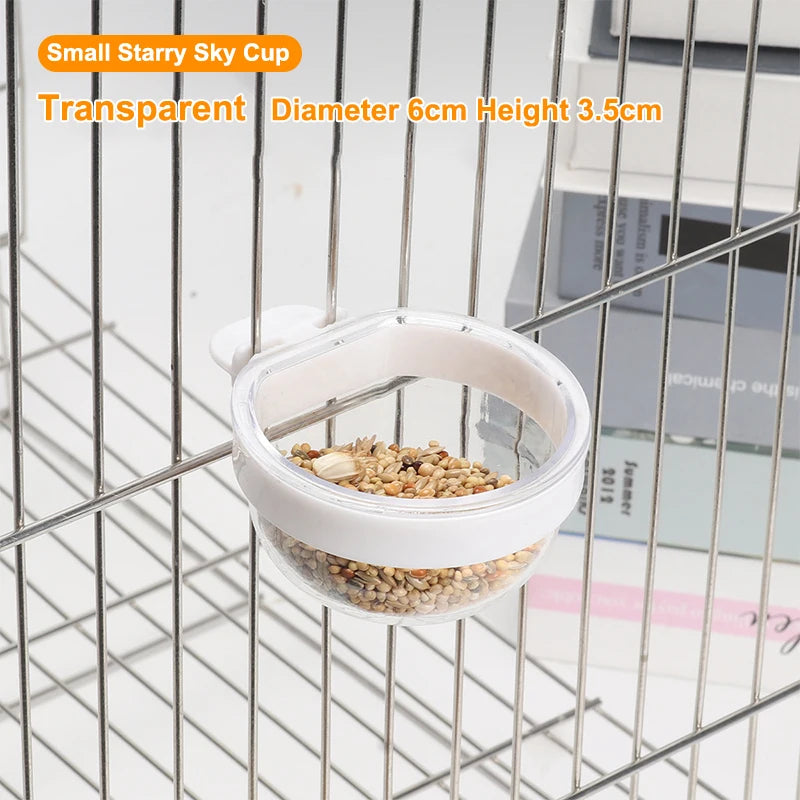 A small transparent sky cup bird feeder with a white lid and a mesh hanging wire.