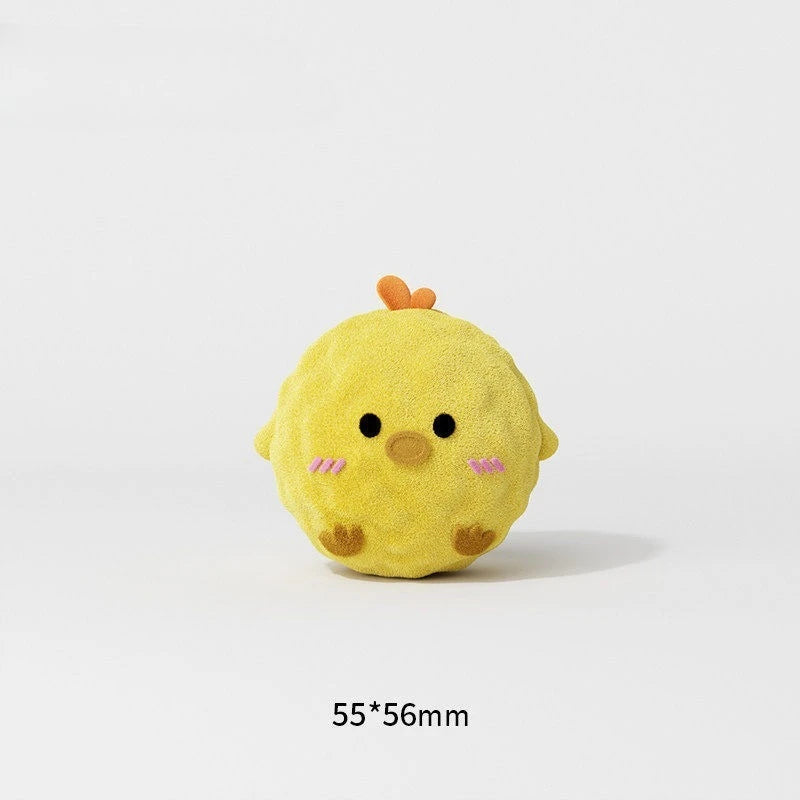 A small, yellow squeaky ball dog chew toy with spiky protrusions and pink accents.