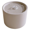 A ceramic automatic pet water fountain with a lid partially removed, showing water flowing.