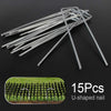 A pile of 15 U-shaped metal nails used as a pet deterrent for garden and home