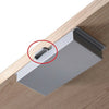 A silver under desk drawer organizer with a dust-proof cover is shown resting on a wooden surface.