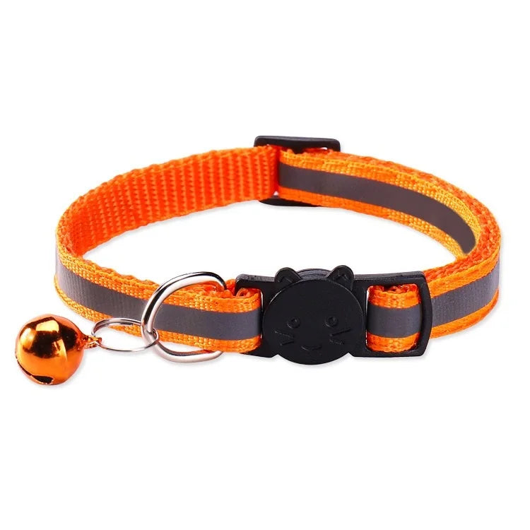 Orange and gray safety breakaway cat collar with a black cat charm and a gold bell.