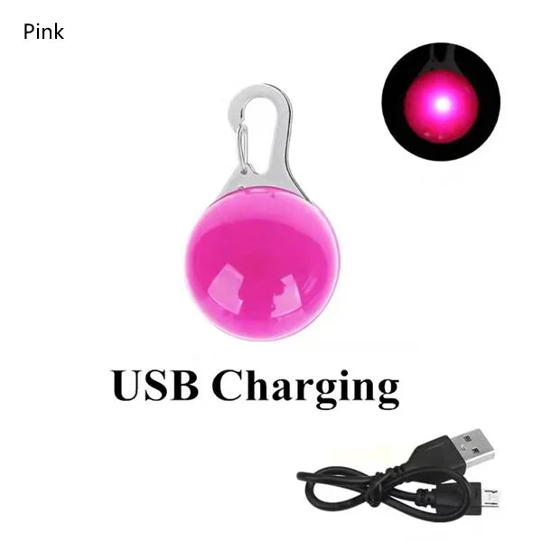 Pink rechargeable LED dog collar light with a USB charging cable.