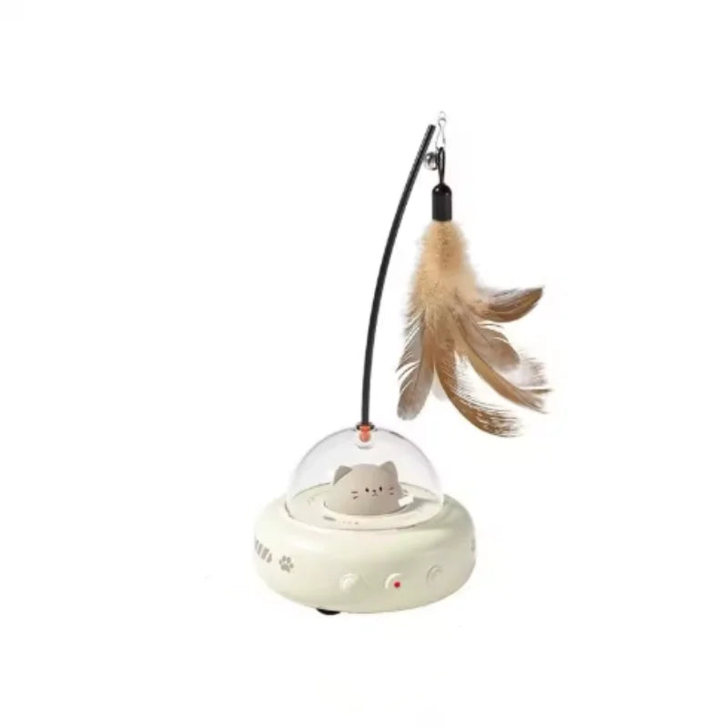 A fluffy brown feather cat toy with a black string and a white base is shown.