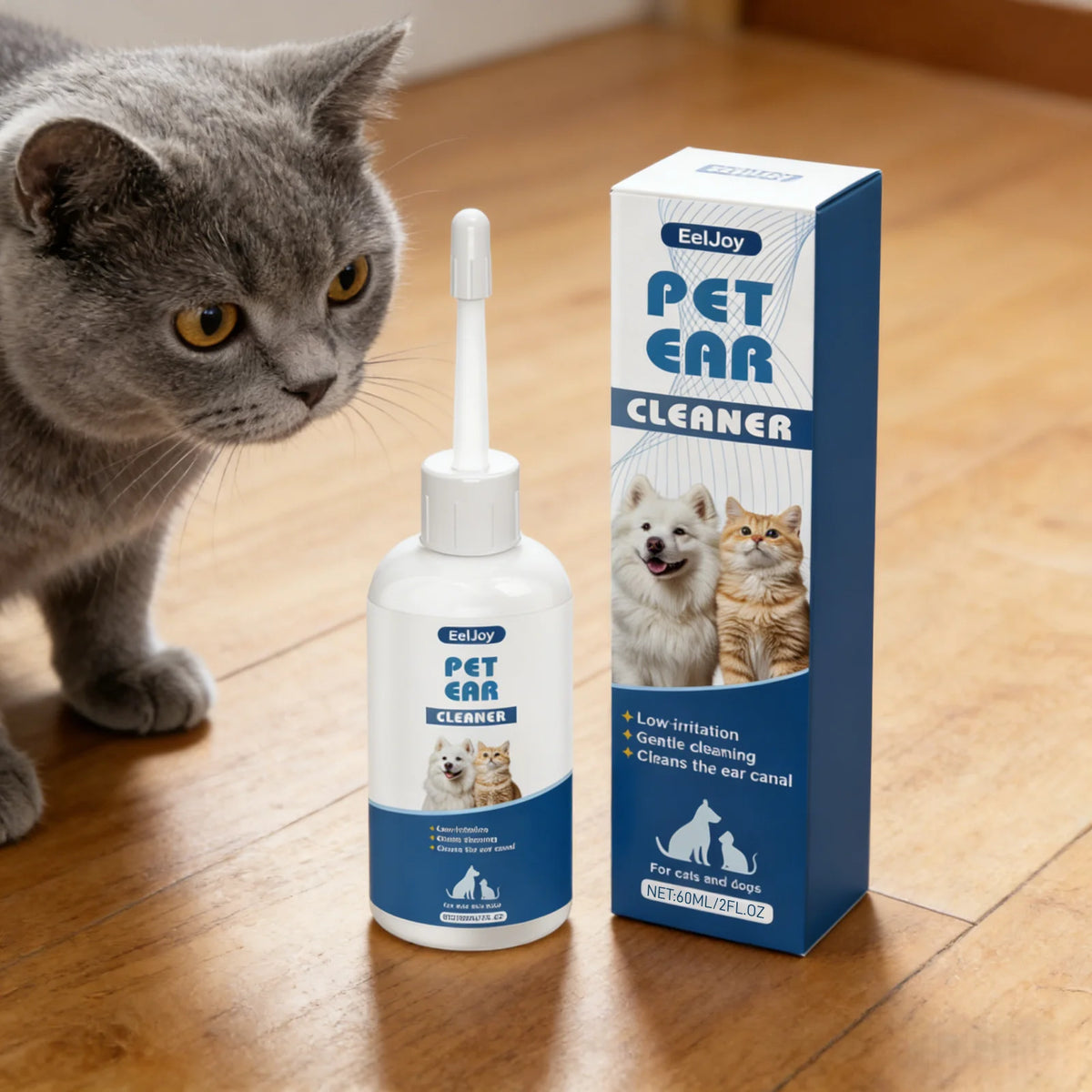 A bottle of EelJoy Pet Ear Cleaner solution next to a tabby cat on a wooden floor.