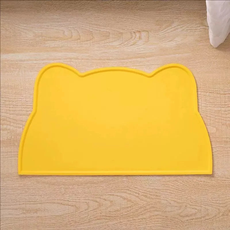 Yellow silicone cat face pet feeding mat for food and water bowls