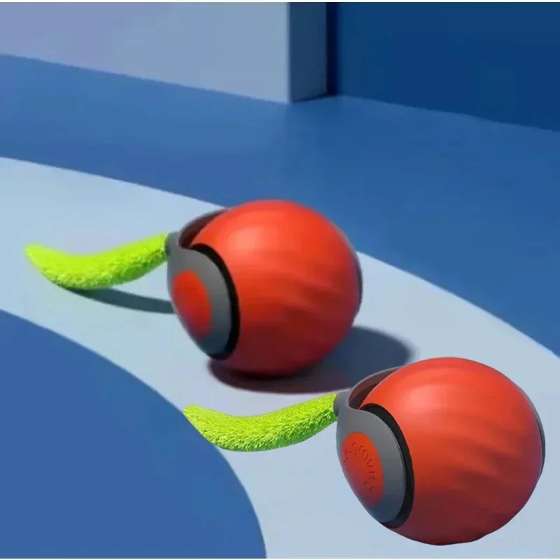 Un juguete de pelota naranja con extensiones peludas verdes sobre una superficie azul.