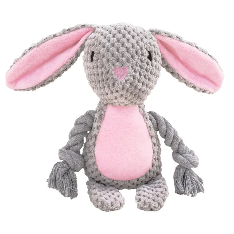 A gray plush animal toy resembling a rabbit with pink inner ears and a pink body, made from braided rope.
