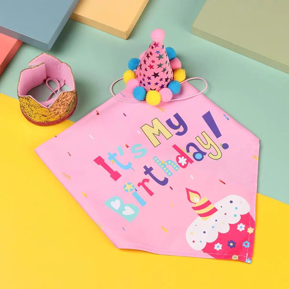 Pink fabric pet birthday party bib with a colorful sequin crown decoration