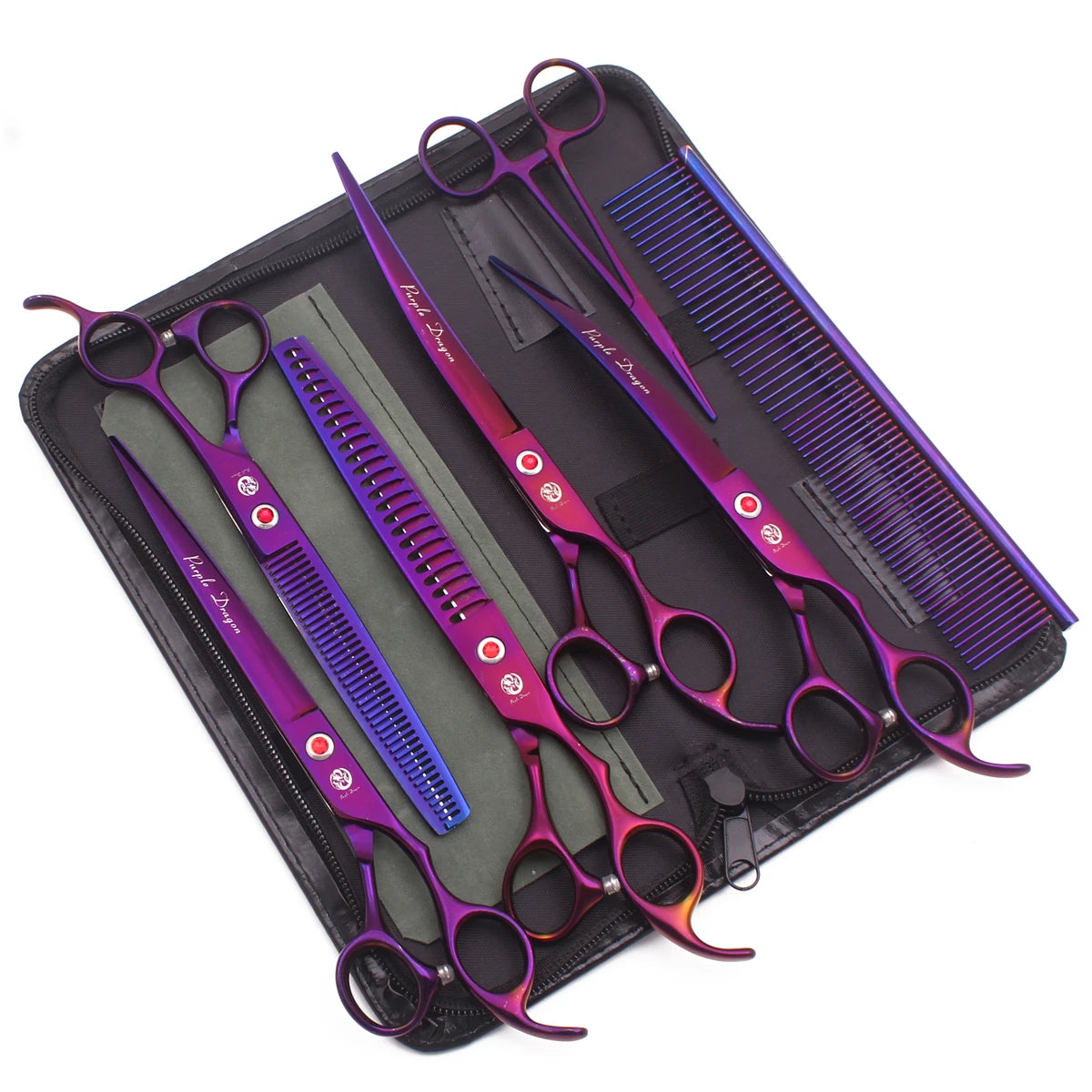 A set of professional stainless steel pet grooming scissors with purple and pink handles and blue blades displayed in a black