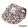 A brown and black leopard print pet grooming visor cap for dogs and cats.