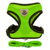 A bright lime green adjustable pet harness and leash set with a paw print design.