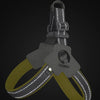 A gray reflective mesh pet harness with a yellow strap and a visible reflective effect against a dark background.