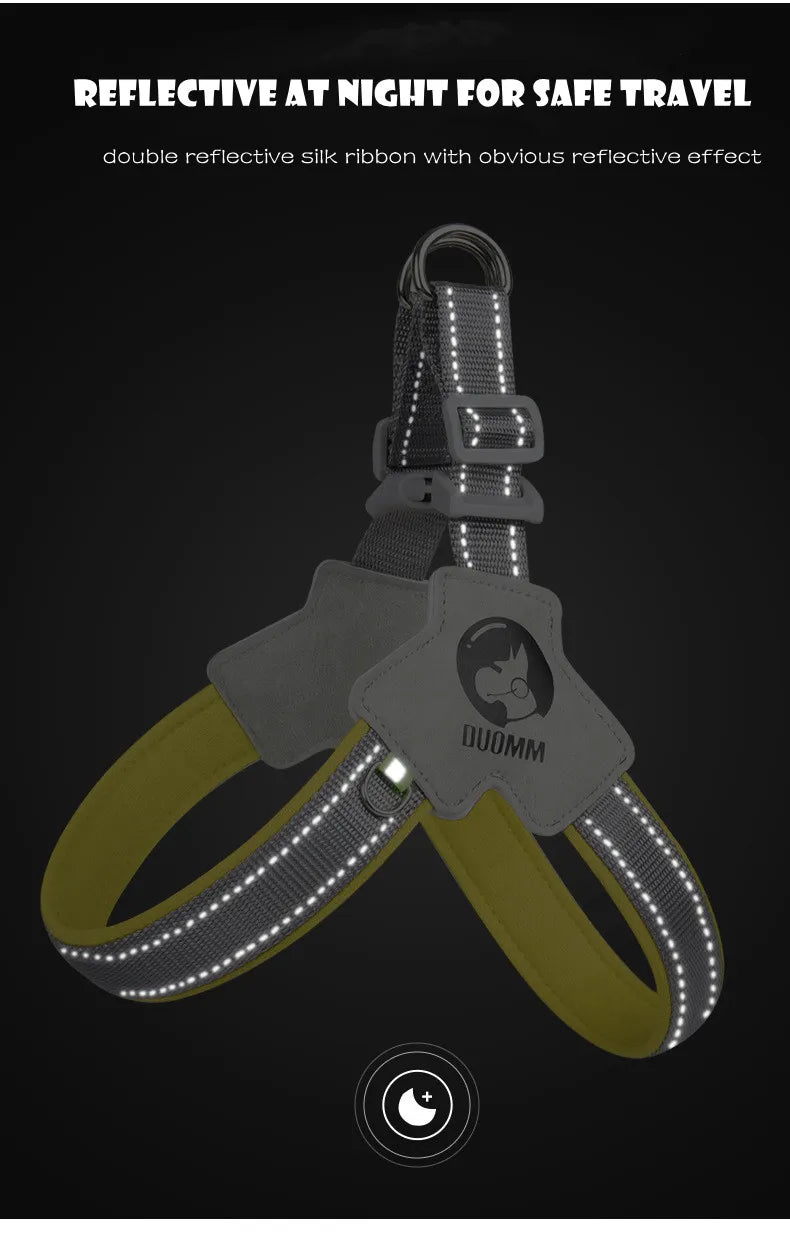 A gray reflective mesh pet harness with a yellow strap and a visible reflective effect against a dark background.