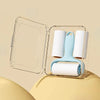 Clear plastic case holding a white lint roller with a light blue handle and roll.