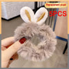 Replacement plush toy ball with white ears and gray fur shown being held by a hand.