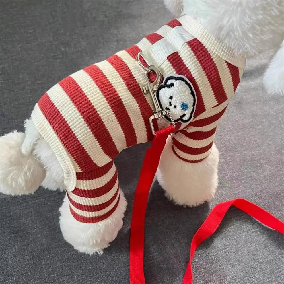 A white and red striped knitted sweater for a dog, featuring a decorative tag on the leg.