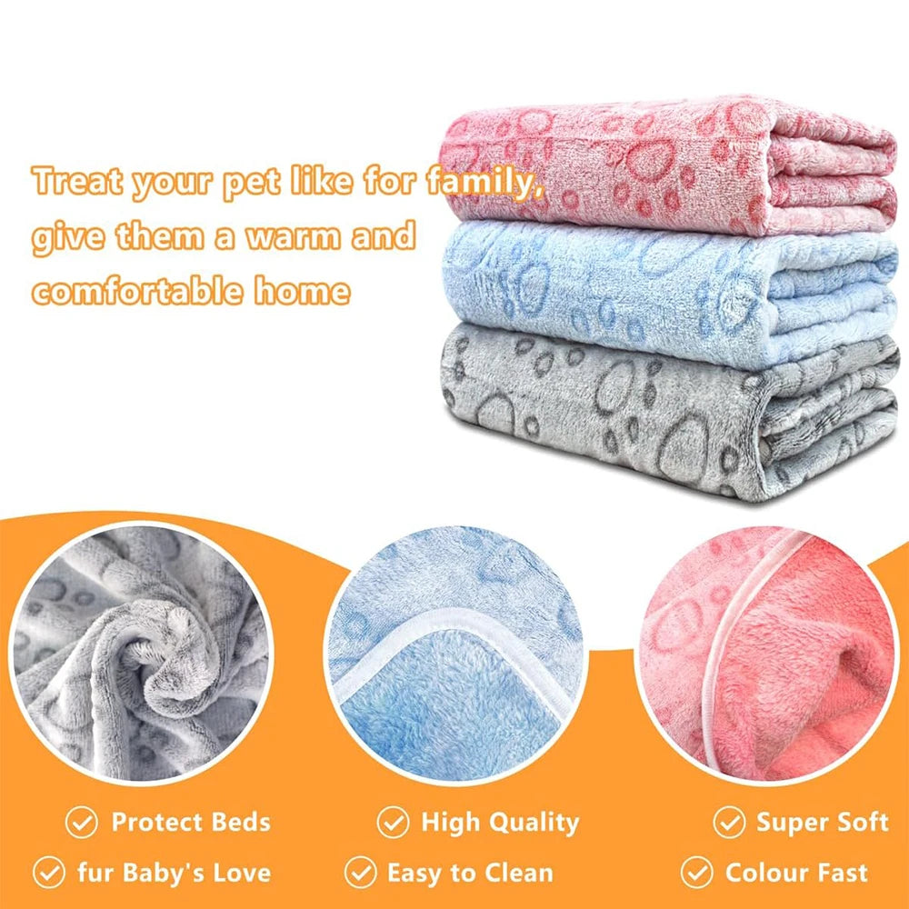 Pink and blue ultra-soft pet blankets with paw print designs for a warm and comfortable home
