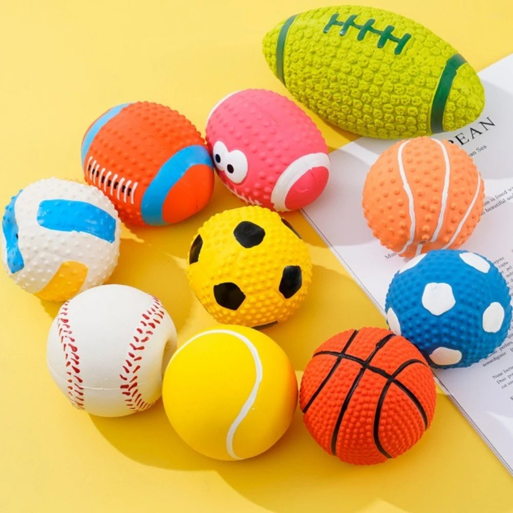 A collection of colorful latex balls including soccer balls, basketballs, and a football, arranged on a yellow surface.