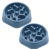 A light blue slow feeder dog bowl with a textured silicone insert and anti-slip base.
