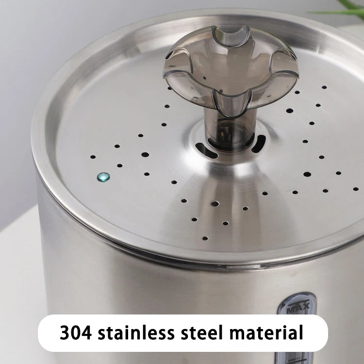 A close-up view of a stainless steel pet water fountain lid with small holes and a blue indicator light.