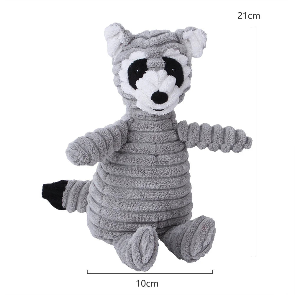 Jouet en velours gris à corduroy ressemblant à un panda avec des marques noires.