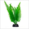 A vibrant green artificial aquarium plant with delicate fronds rooted in a small black rock.
