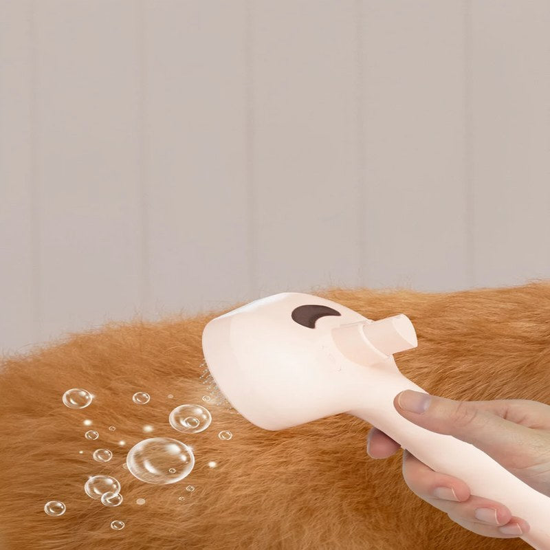 A hand is using a pink steam pet grooming comb with a mist function on an orange-colored dog's fur.