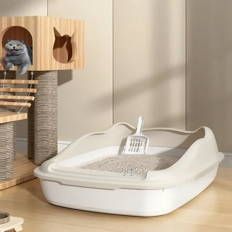 Arenero compacto de bordes altos para gatos