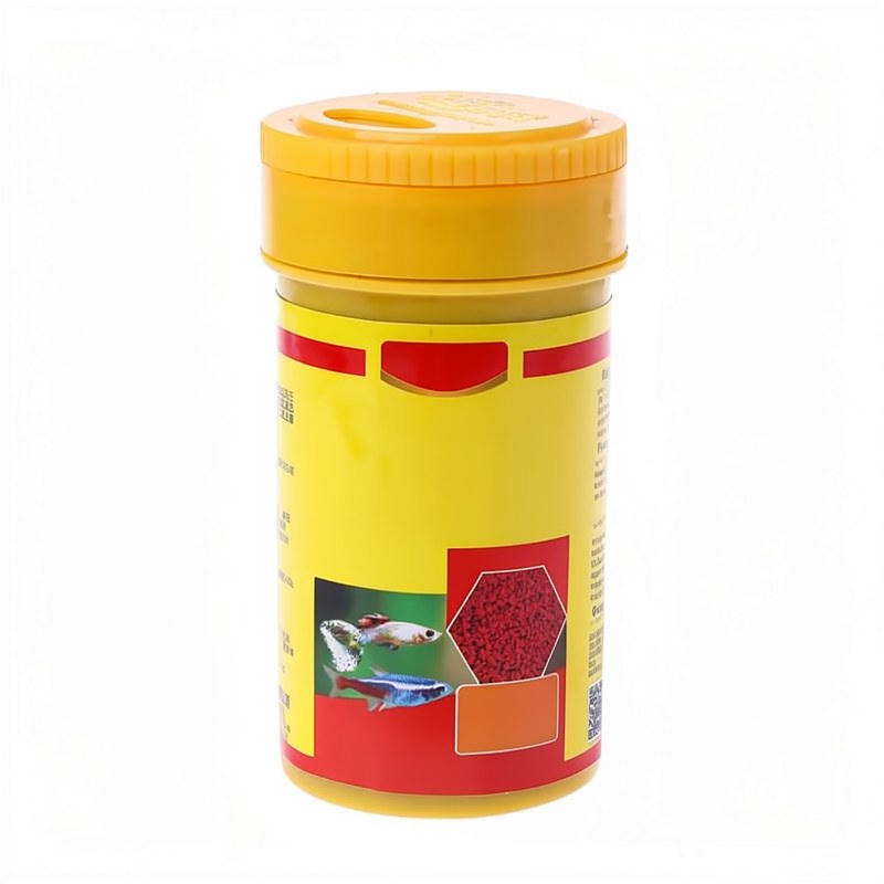 Conteneur jaune de spiruline et de nourriture pour poissons tropicale colorée