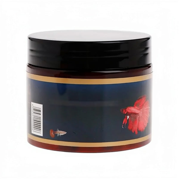 A glass jar of Astaxanthin fish food tablets with a black lid and dark blue label featuring a red fish.