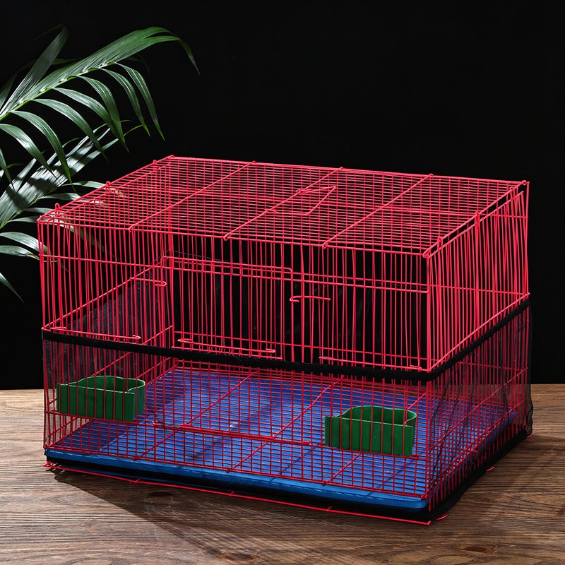 A red mesh bird cage cover is shown resting on a wooden surface.