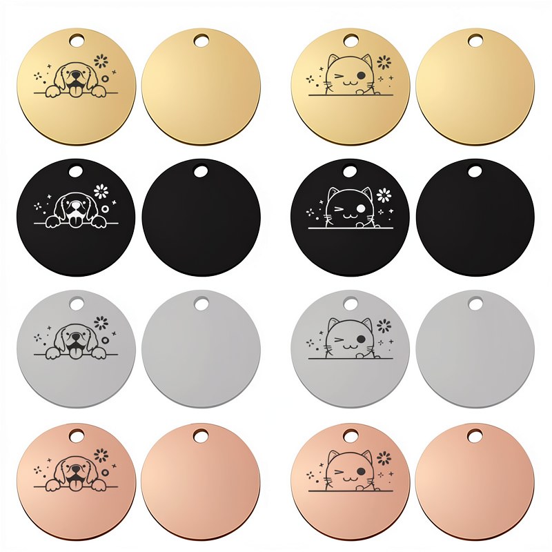 A collection of round stainless steel pet ID tags in gold, black, and silver finishes.