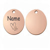 Two round rose gold stainless steel pet ID tags with the word Name engraved on them