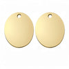 A pair of round, gold-colored stainless steel pet ID tags with a loop for attachment.