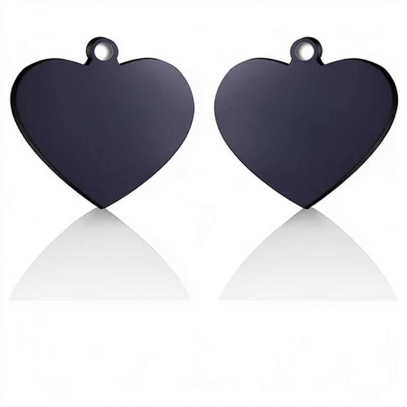 A pair of dark gray heart-shaped stainless steel pet ID tags with loops.